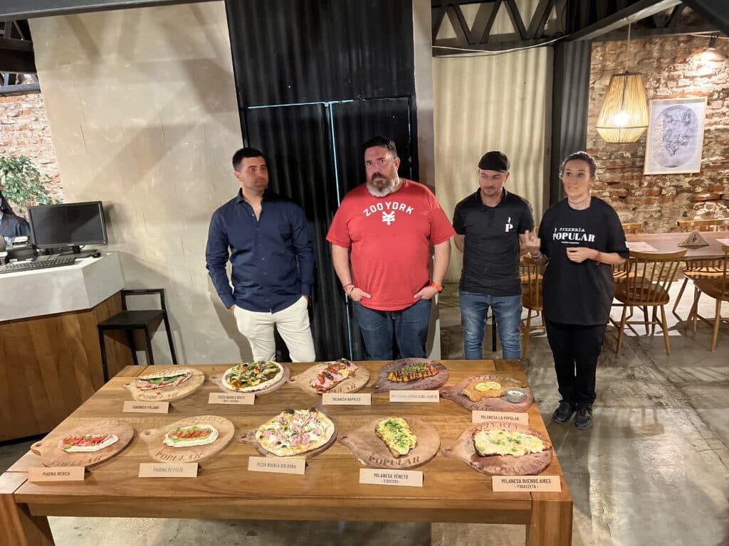 Pizzería Popular quiere 100 puntos y avanza fuerte en el exterior